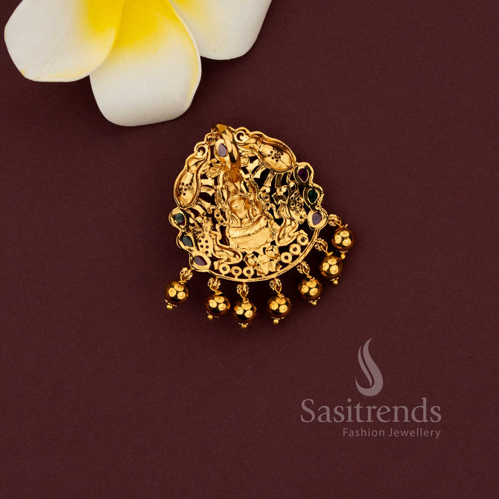 Temple pendant featuring Lakshmi with elephant motif in matte gold finish