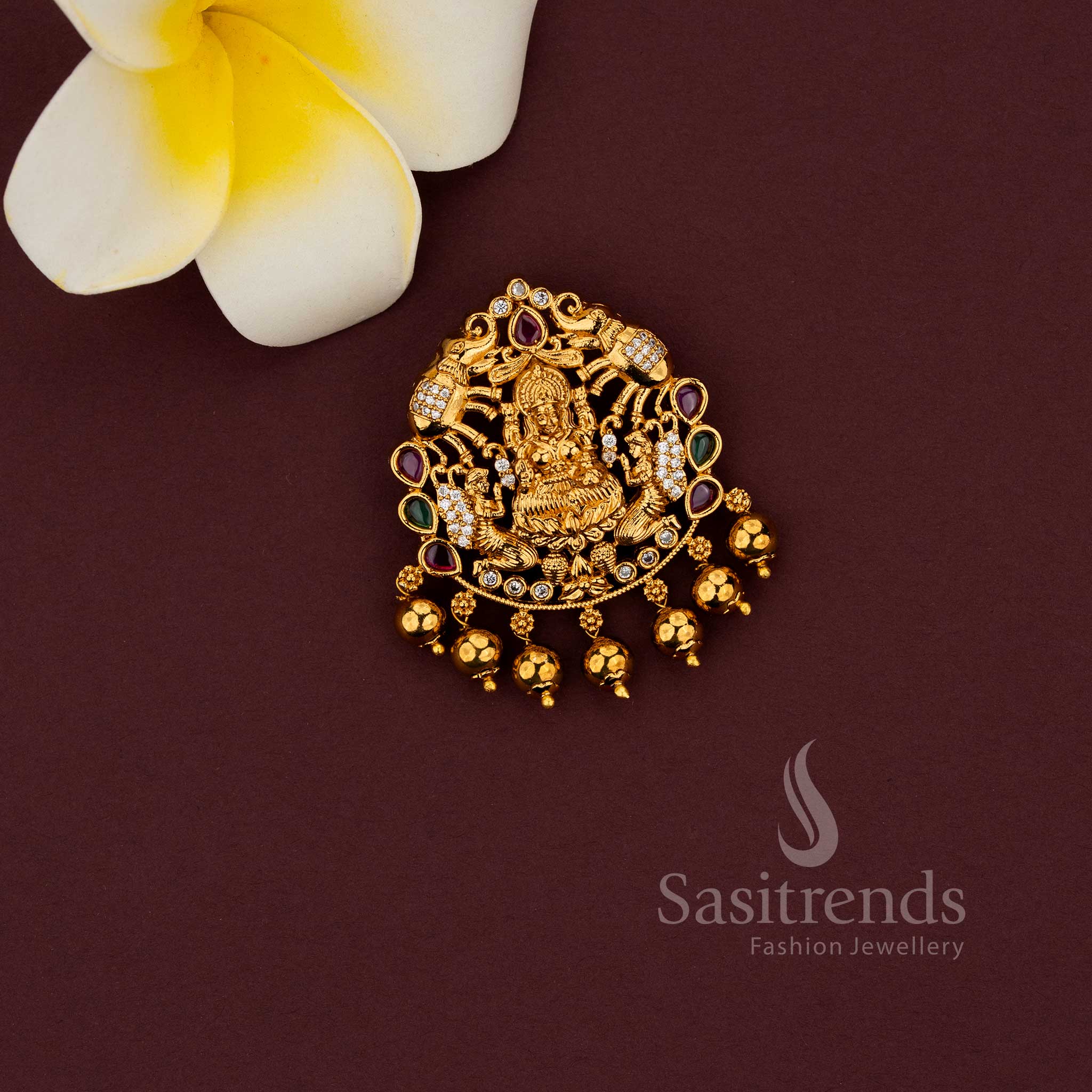 Temple pendant featuring Lakshmi with elephant motif in matte gold finish