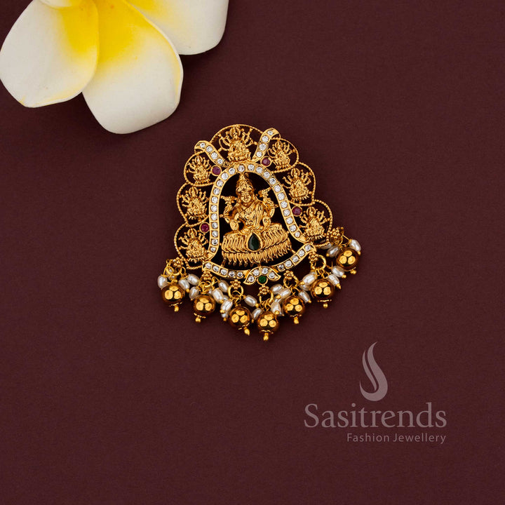 	Temple jewellery pendant featuring Gaja Lakshmi motif and intricate detailing 