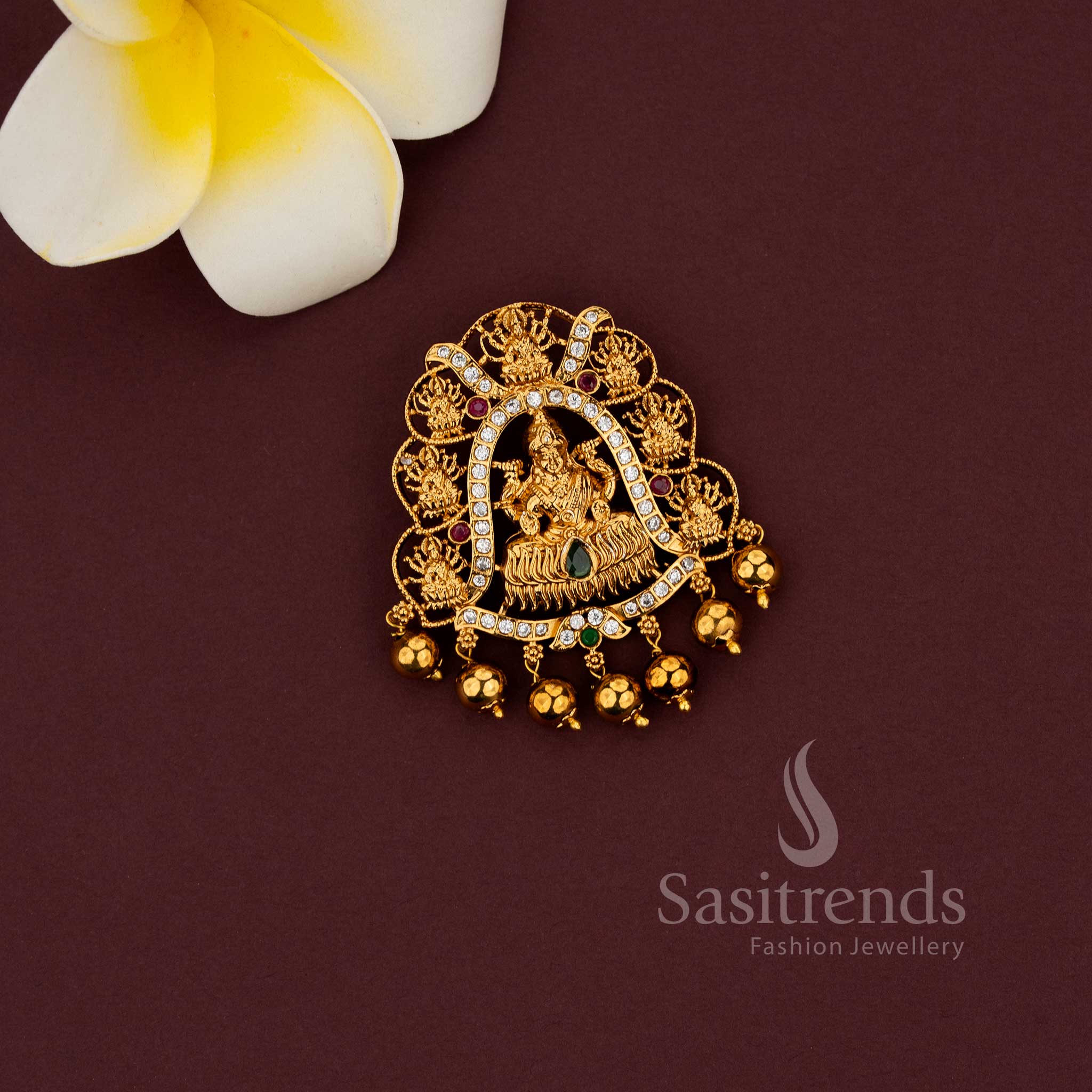 Temple jewellery pendant featuring Gaja Lakshmi motif and intricate detailing 
