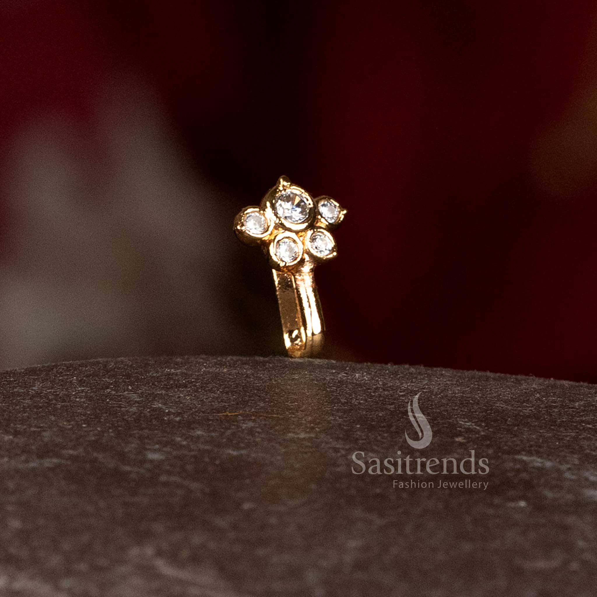 Detailed view of sparkling diamond stone cluster on designer pressing nosepin - Sasitrends