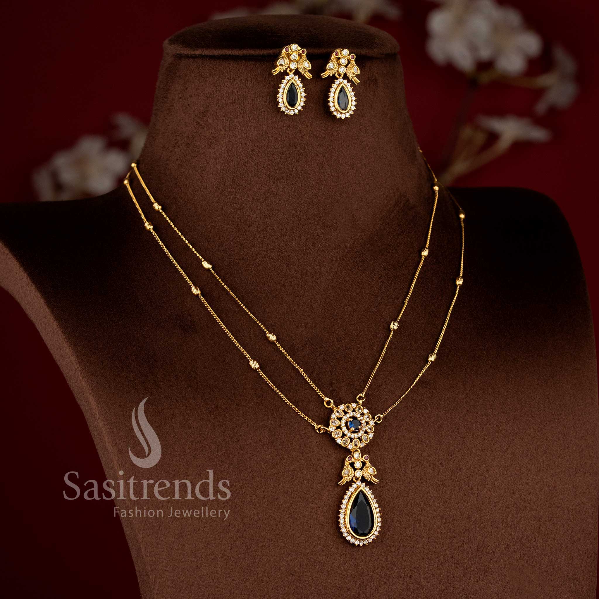 Traditional Two Line Chain Necklace Jewellery Set with American Diamond Stones, blue Center Detailing and Matte Gold Finish - Sasitrends 