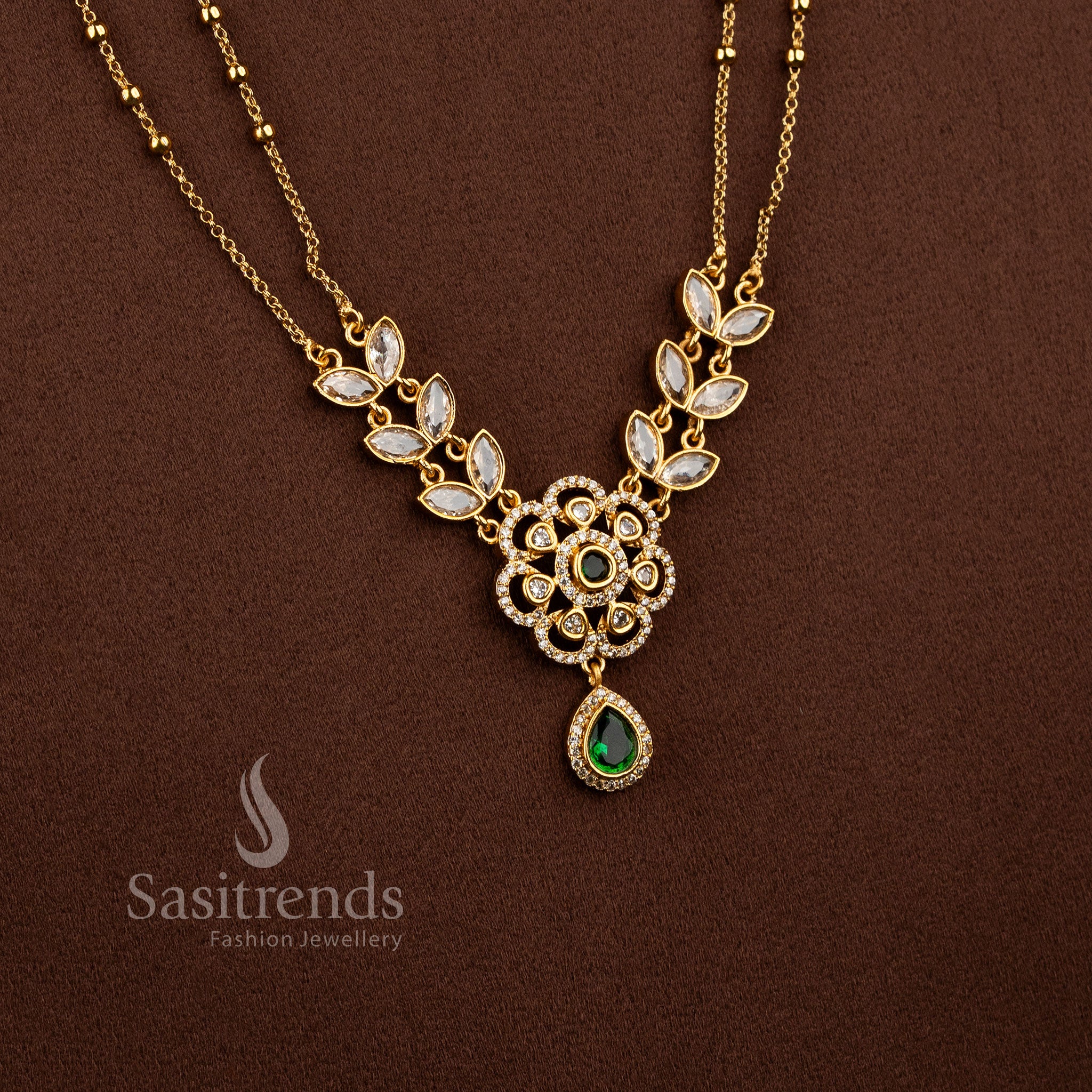 Dual Layer Floral Necklace Jewellery Set with American Diamond stones, Green detailing, and matte gold plated finish - Sasitrends