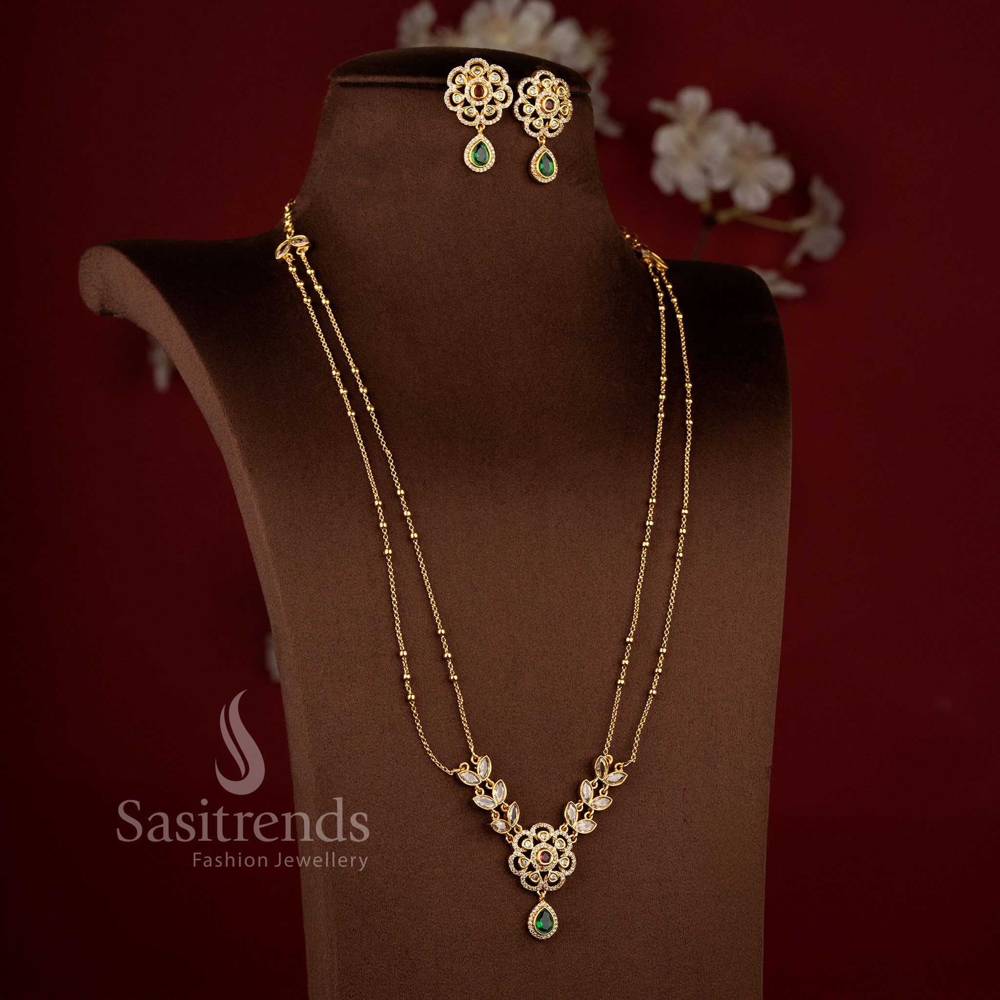 Exquisite American Diamond Matte Gold Two Line Floral Necklace Set featuring Ruby Green stone accents and elegant dual layer traditional jewellery design - Sasitrends