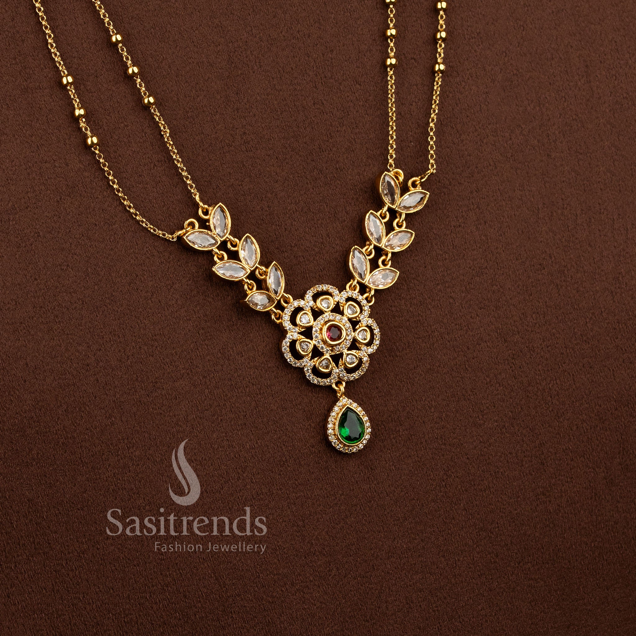 Exquisite American Diamond Matte Gold Two Line Floral Necklace Set featuring Ruby Green stone accents and elegant dual layer traditional jewellery design - Sasitrends