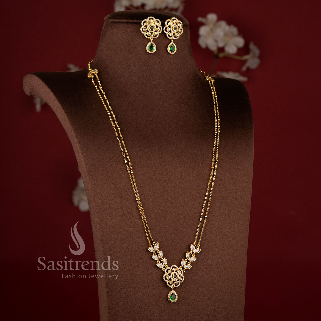 Elegant Two Line Floral Necklace Set with Green center stones, sparkling AD stones, and traditional matte gold styling - Sasitrends