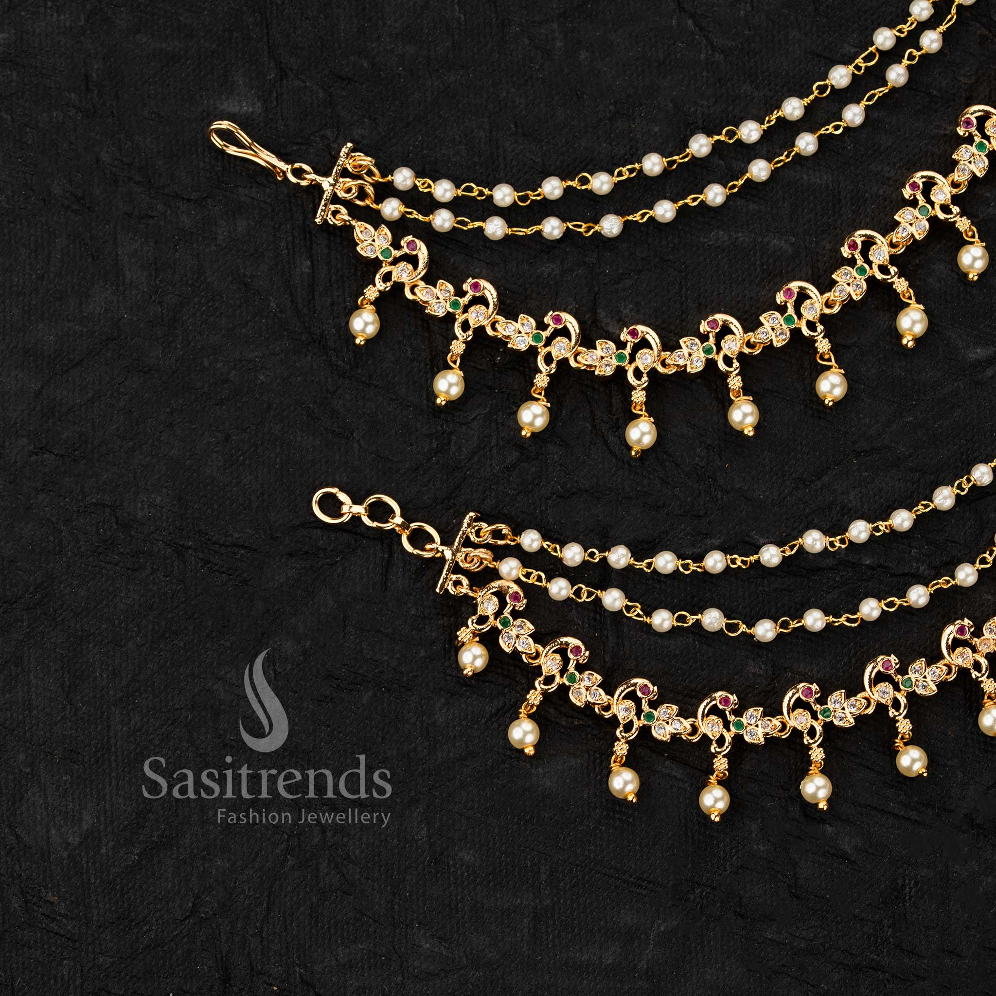 Micro gold plated ear chains featuring peacock motif with AD stones and pearl drop detailing in elegant design - Sasitrends