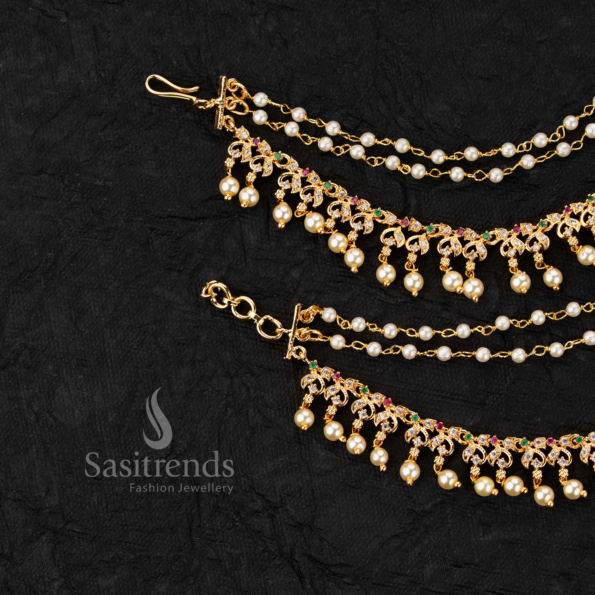 Micro gold plated ear chains featuring motif with AD stones and pearl drop detailing in elegant design 