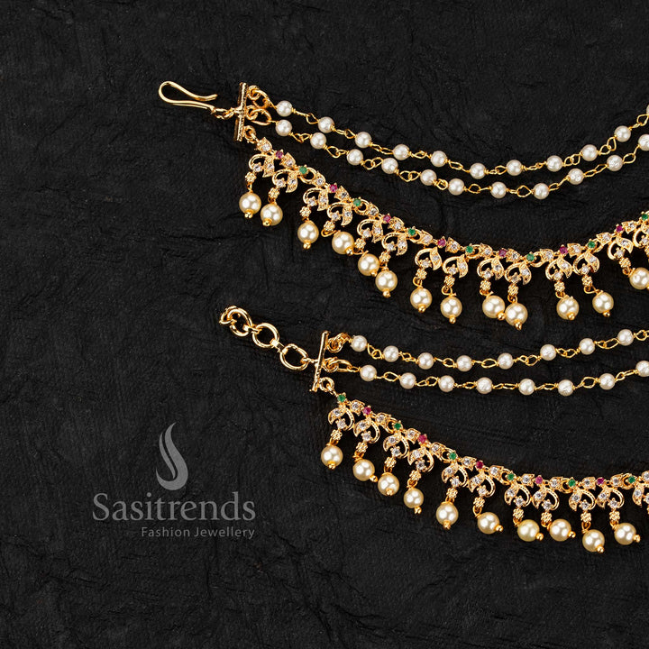 Micro gold plated ear chains featuring motif with AD stones and pearl drop detailing in elegant design 
