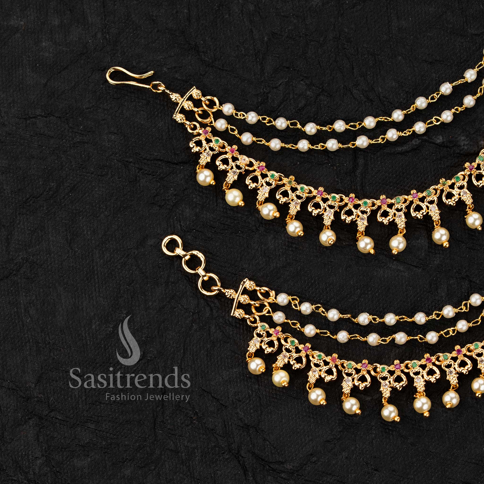 Micro gold plated ear chains featuring motif with AD stones and pearl drop detailing in elegant design