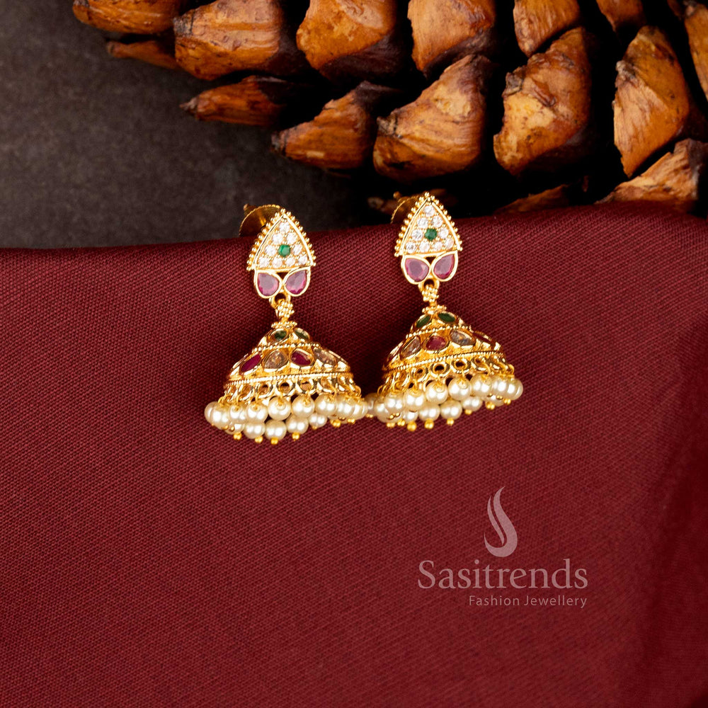 Traditional 24K micro gold plated jhumka earrings featuring ruby/white AD stones and a fringe of hanging pearls - Sasitrends