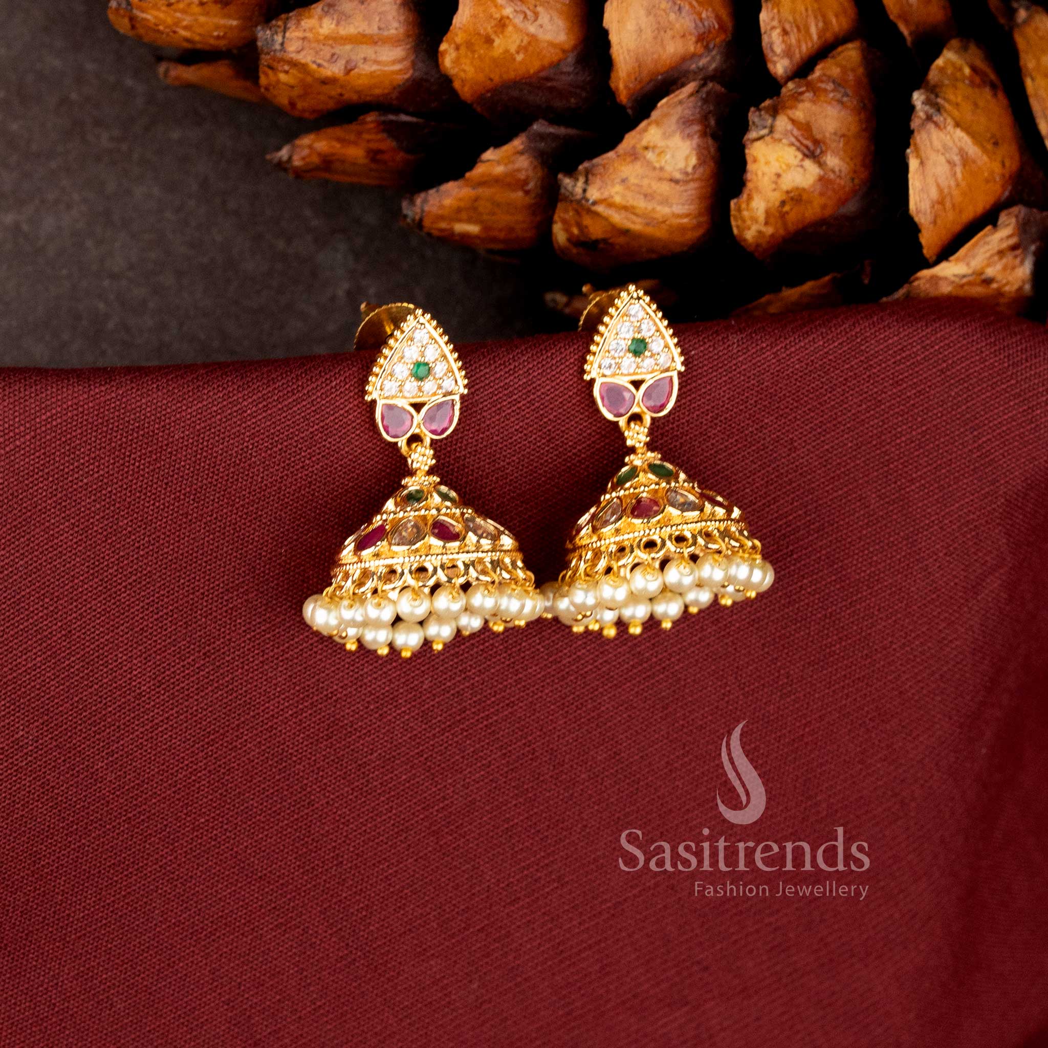 Traditional 24K micro gold plated jhumka earrings featuring ruby/white AD stones and a fringe of hanging pearls - Sasitrends