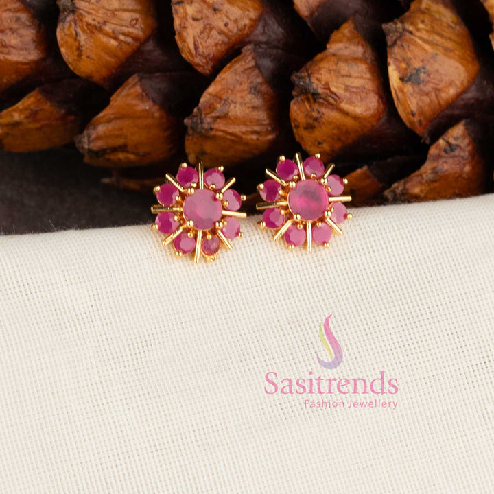 Trendy gold plated white American Diamond stud earrings with swirl floral pattern.