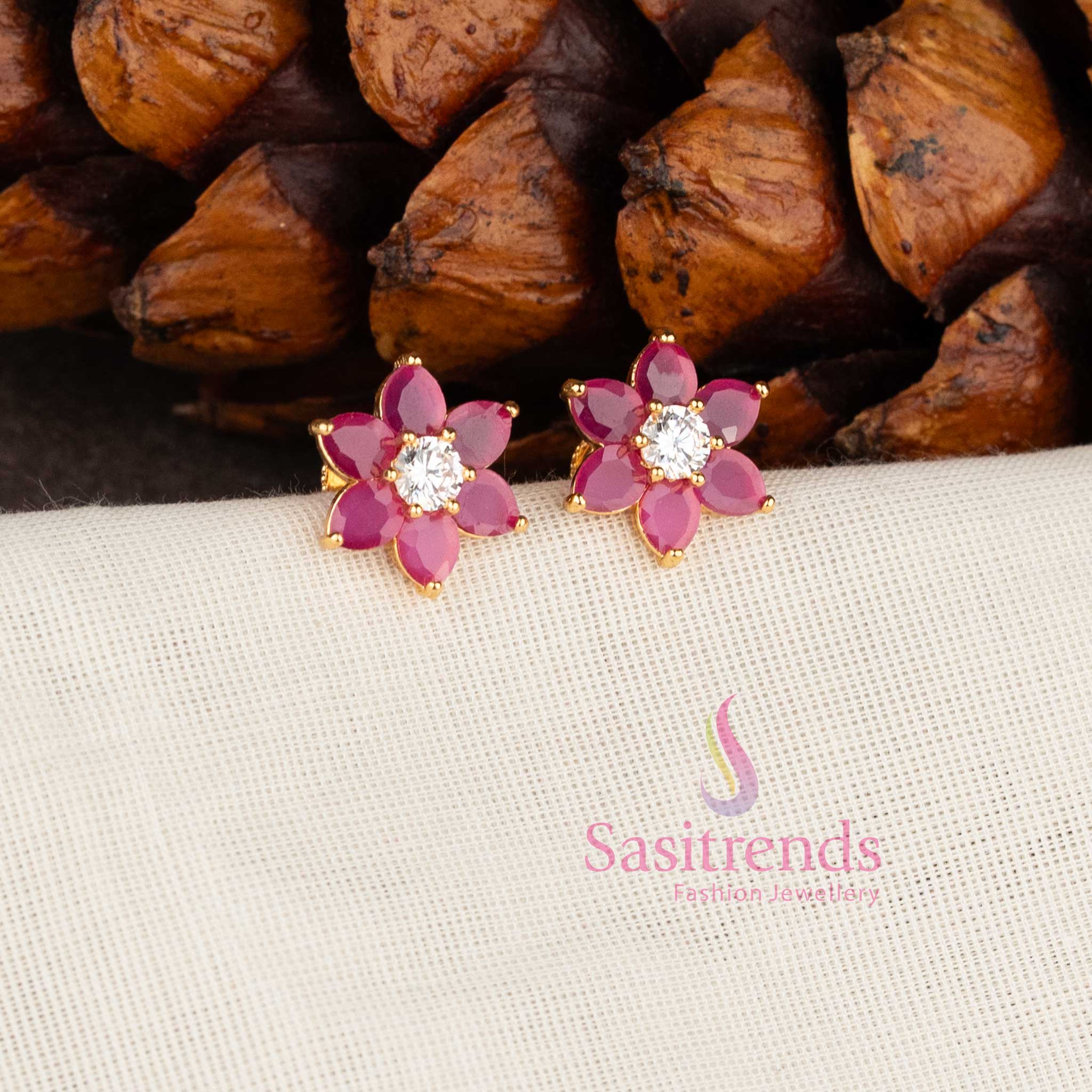 Elegant ruby white floral stone stud earrings with micro gold finish by Sasitrends
