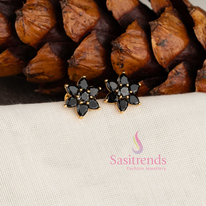 Stylish micro gold plated floral stud earrings with sparkling black AD stones.