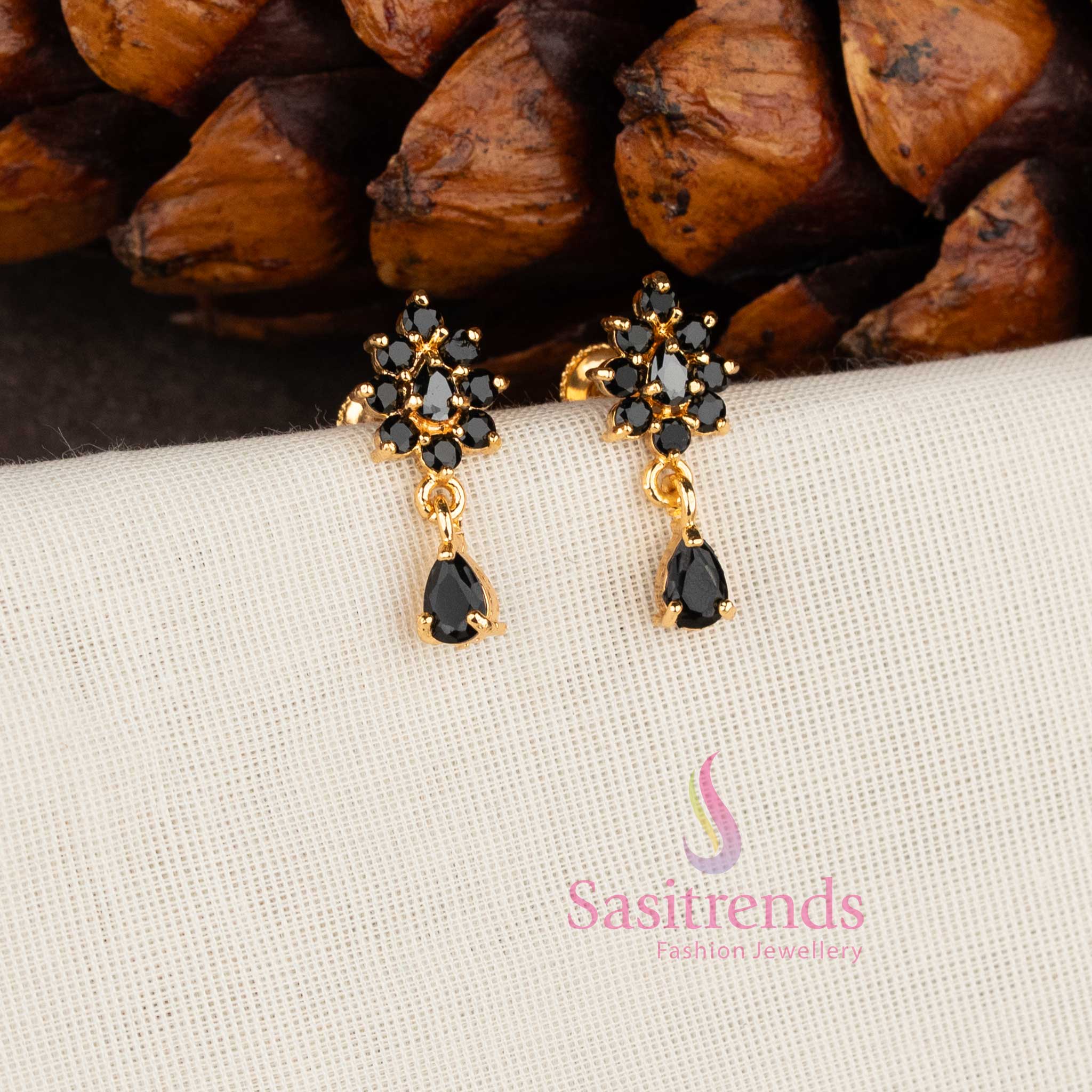 Sparkling micro gold plated American Diamond floral stud earrings with white stones by Sasitrends.