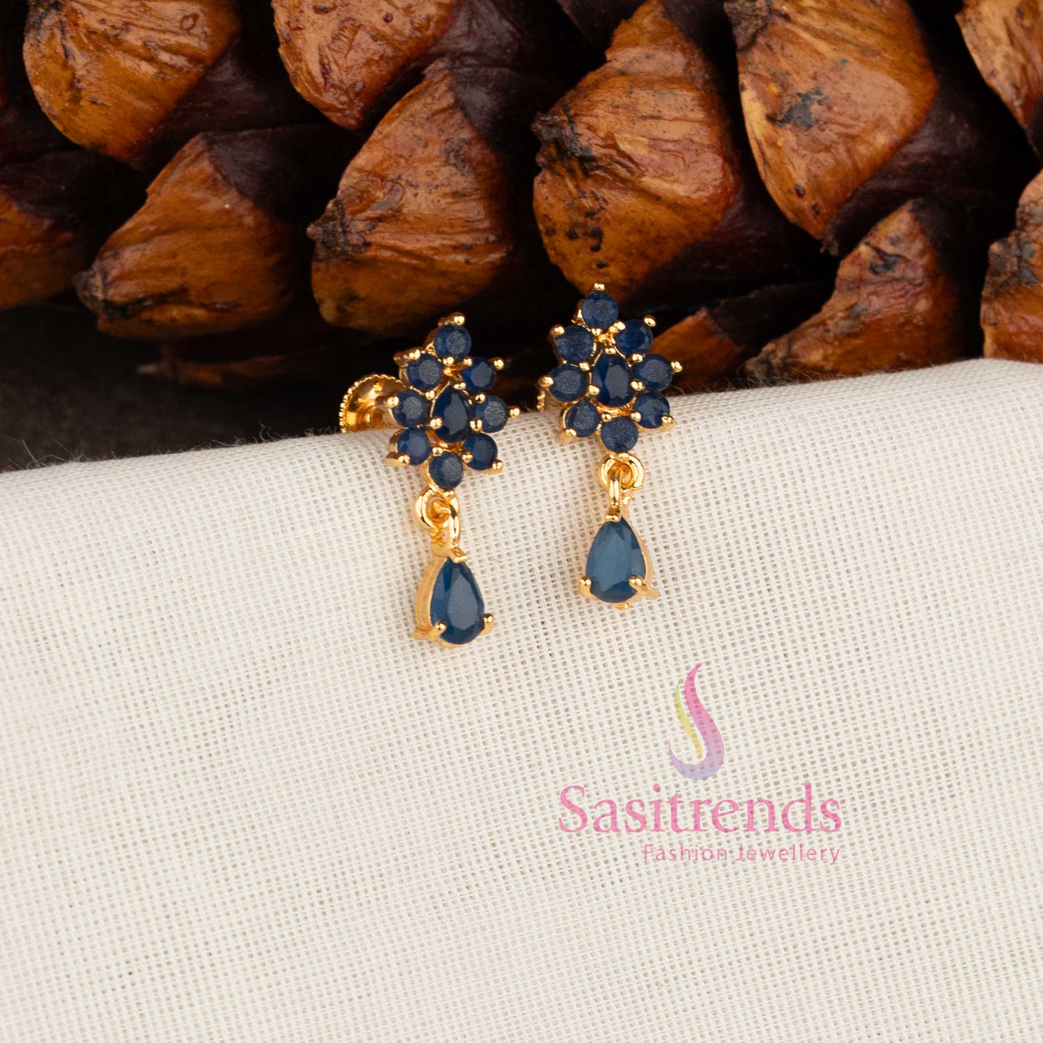 Sparkling micro gold plated American Diamond floral stud earrings with white stones by Sasitrends.
