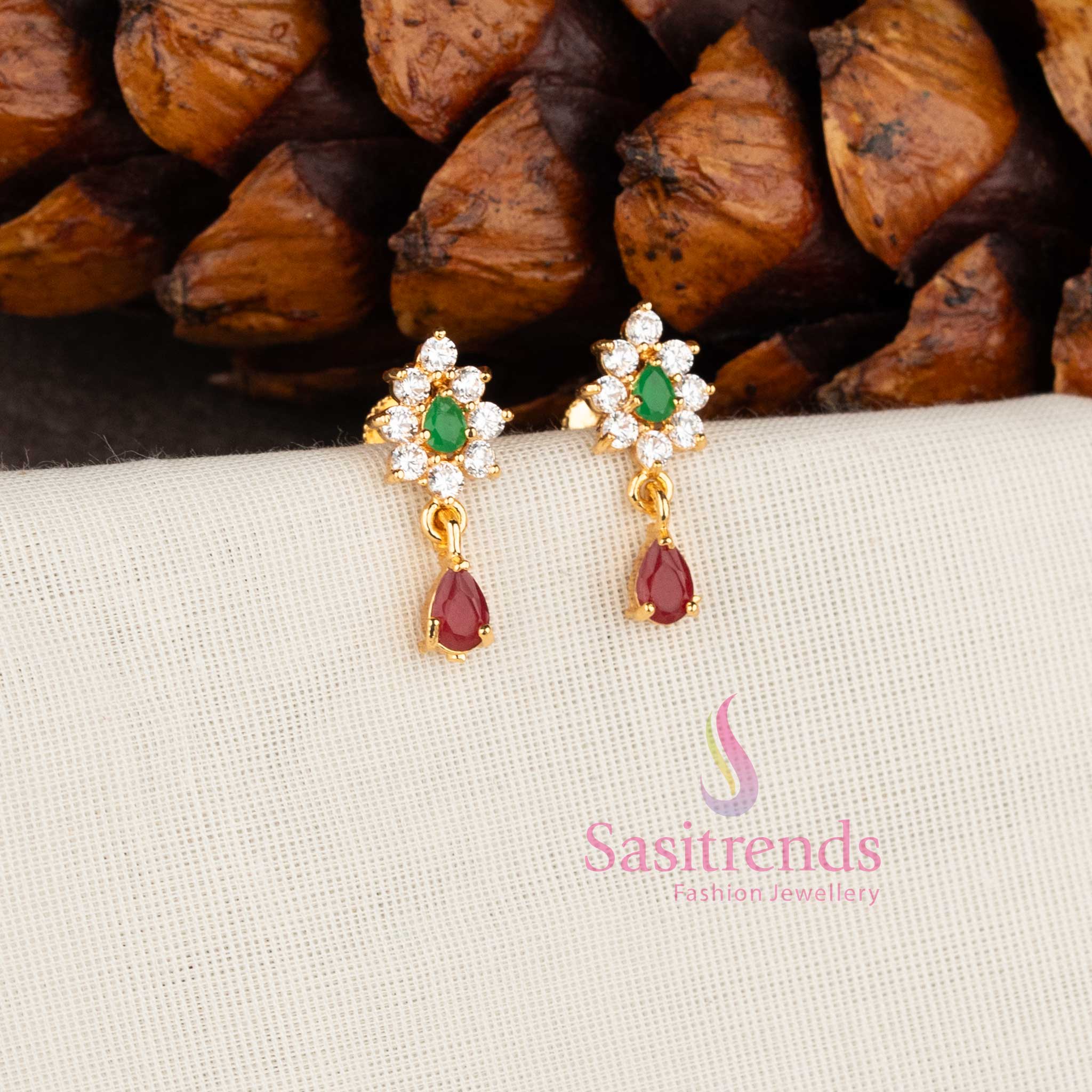 Sparkling micro gold plated American Diamond floral stud earrings with white stones by Sasitrends.