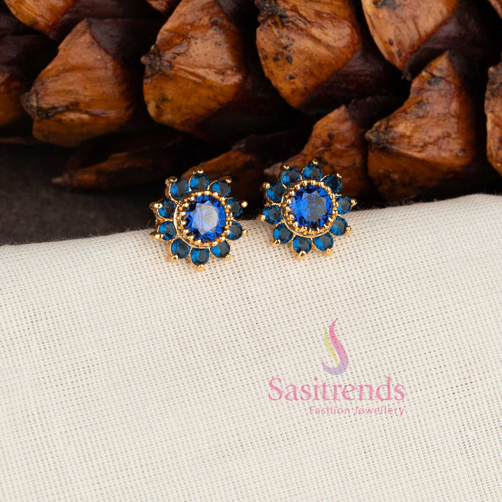 Royal floral one gram micro gold plated look American diamond stone stud earrings in Blue - Sasitrends