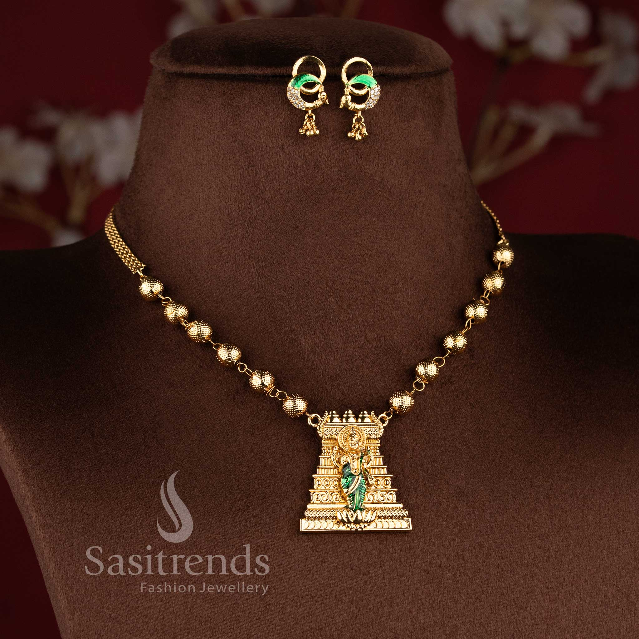 Designer temple necklace set with traditional Lakshmi pendant and matching ethnic earrings - Sasitrends.