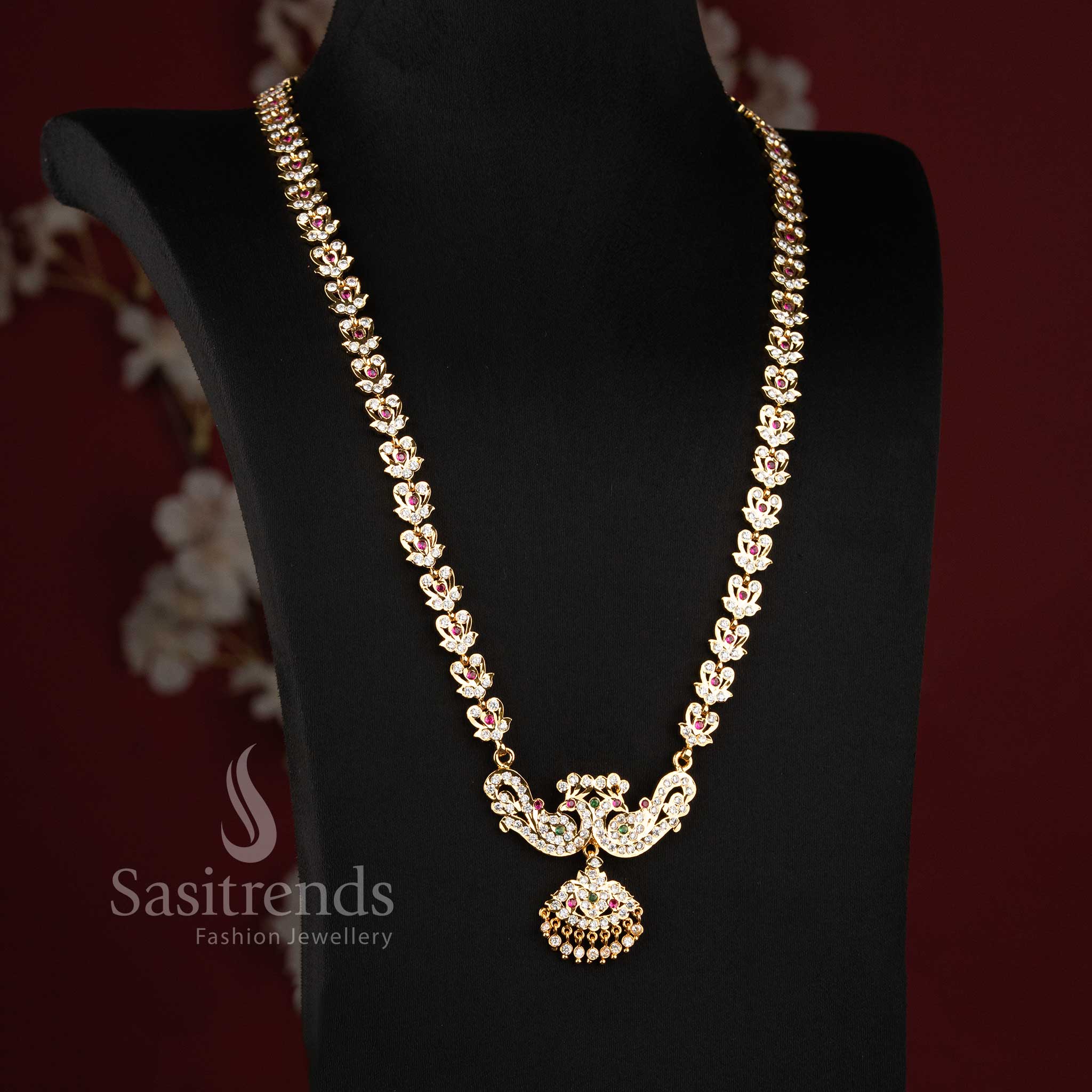 Elegant bridal-style AD stone long haram chain ensemble with a dual peacock pendant.