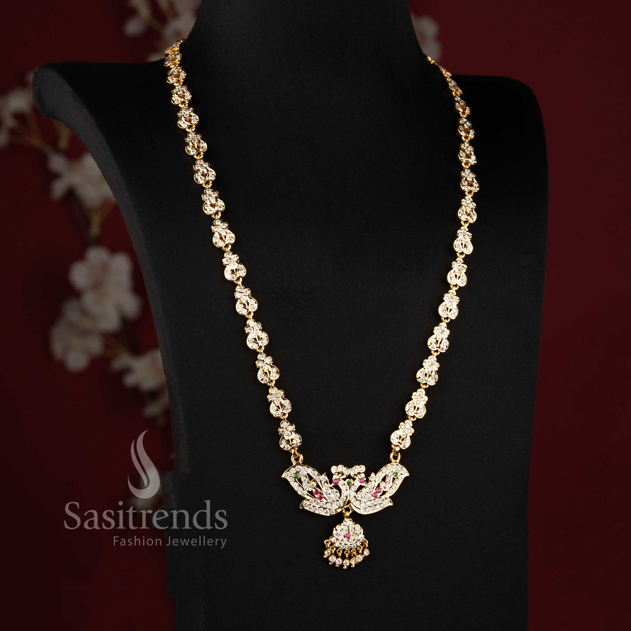 Elegant bridal-style AD stone long haram chain ensemble with a dual peacock pendant.