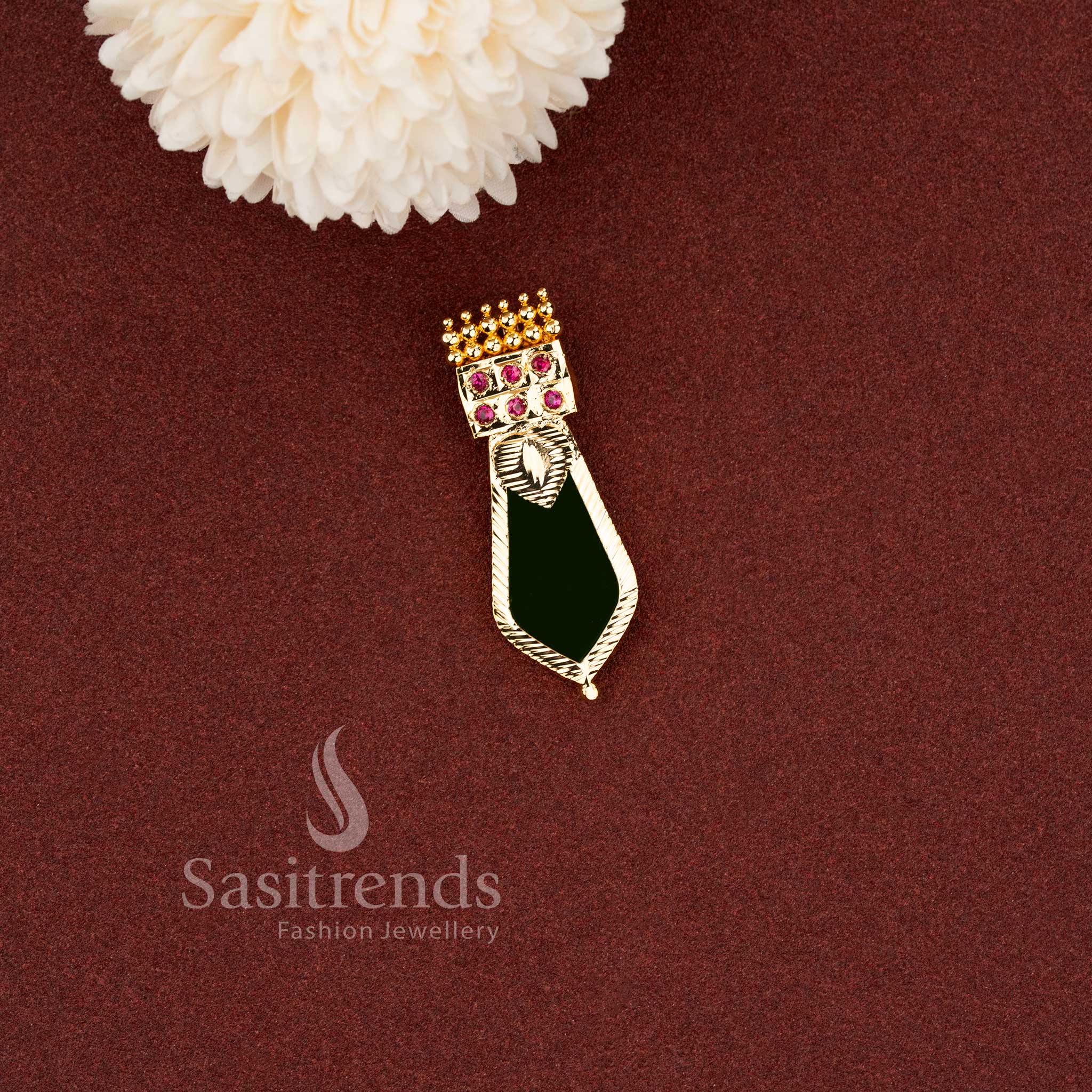 Traditional green enamel Nagapadam pendant designed with ruby stone accents and textured gold finish - Sasitrends