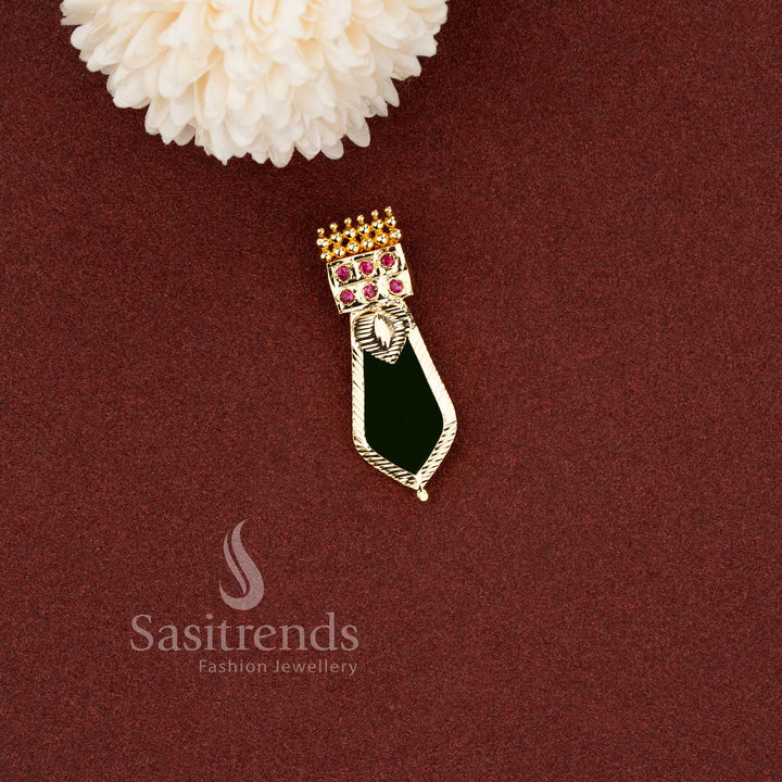 Traditional green enamel Nagapadam pendant designed with ruby stone accents and textured gold finish - Sasitrends