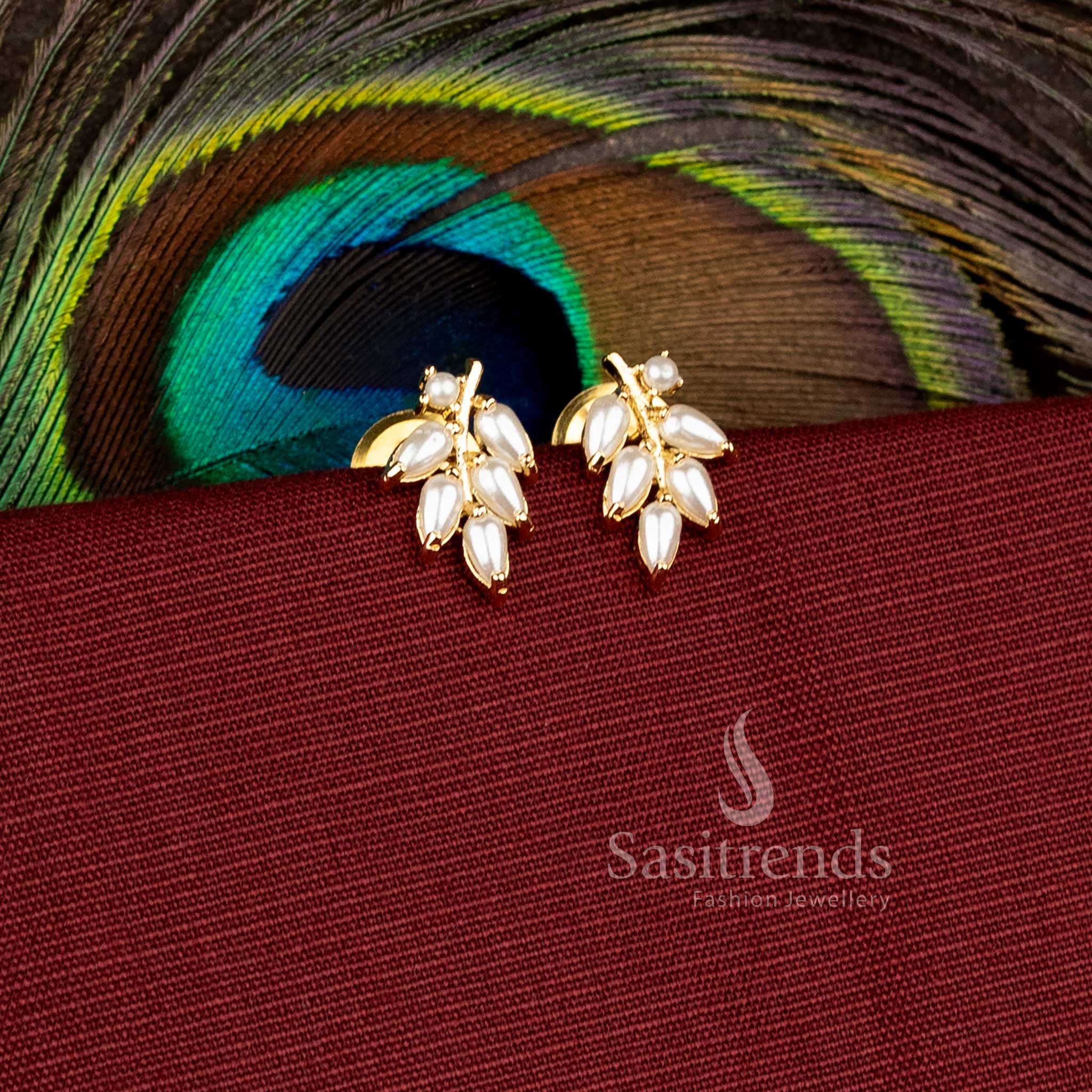 Elegant festive wear earrings designed with sparkling leaf stone patterns - Sasitrends