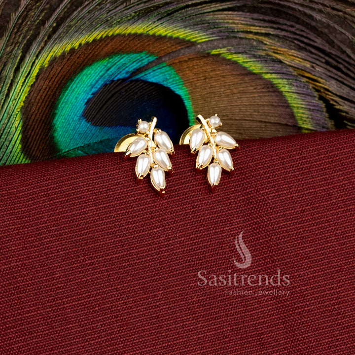 Elegant festive wear earrings designed with sparkling leaf stone patterns - Sasitrends