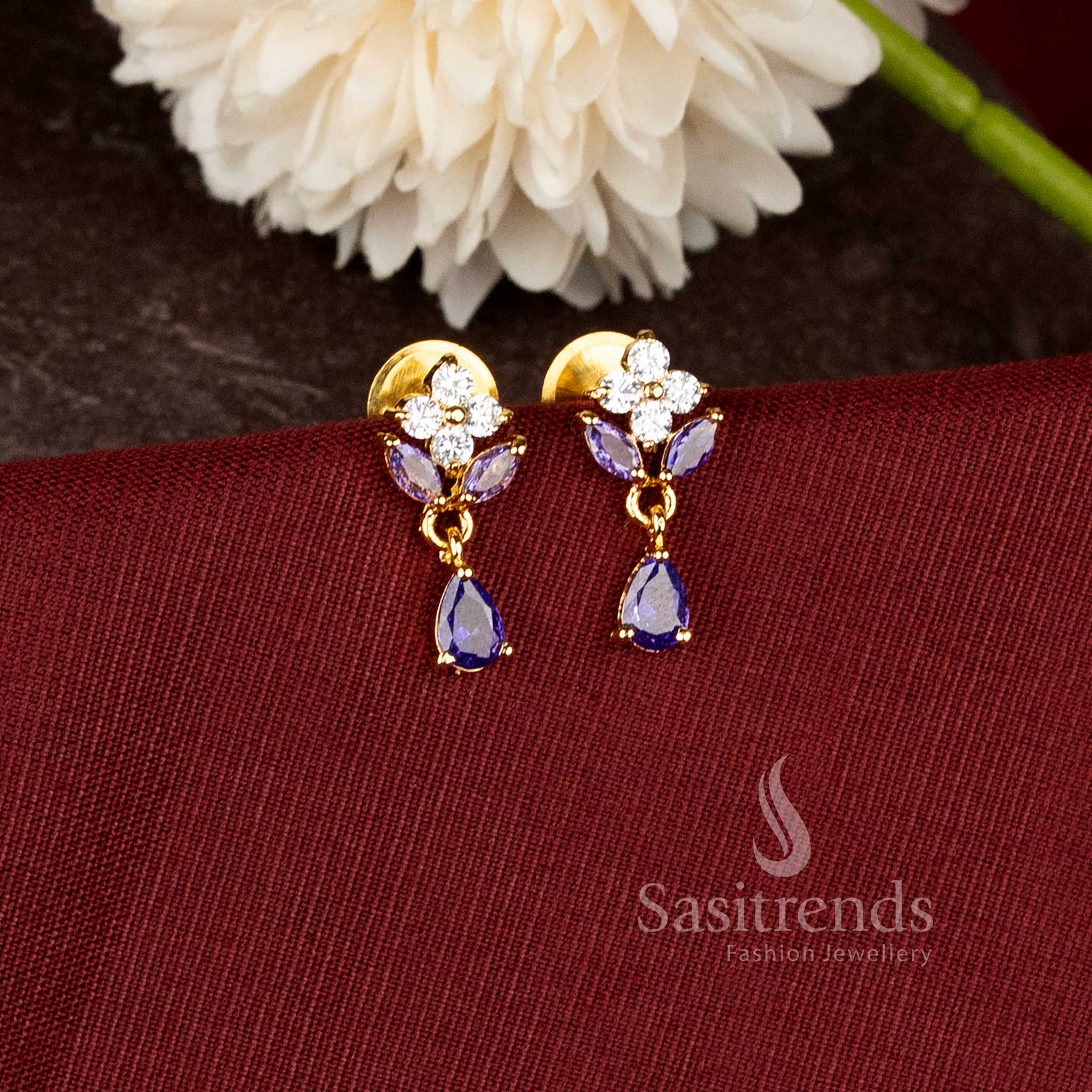 Traditional party wear pearl drop earrings with green stone floral design and rich real gold look finish - Sasitrends
