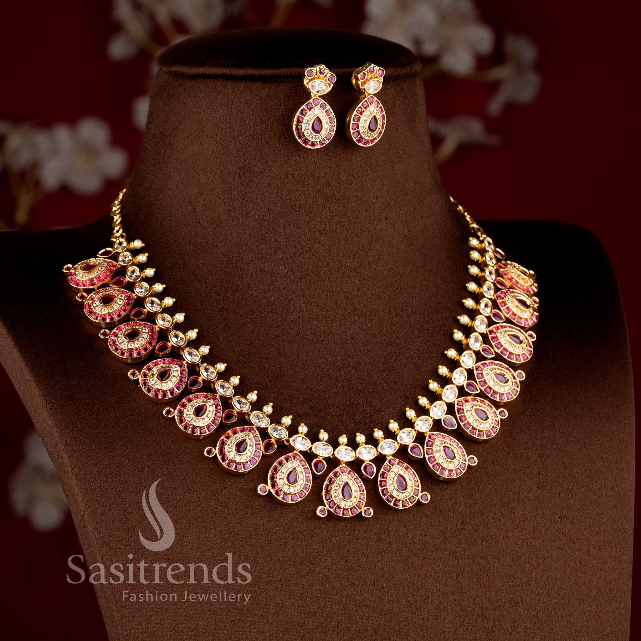 Stylish micro gold plated bridal jewellery collection with brilliant white and ruby American Diamond stone clusters