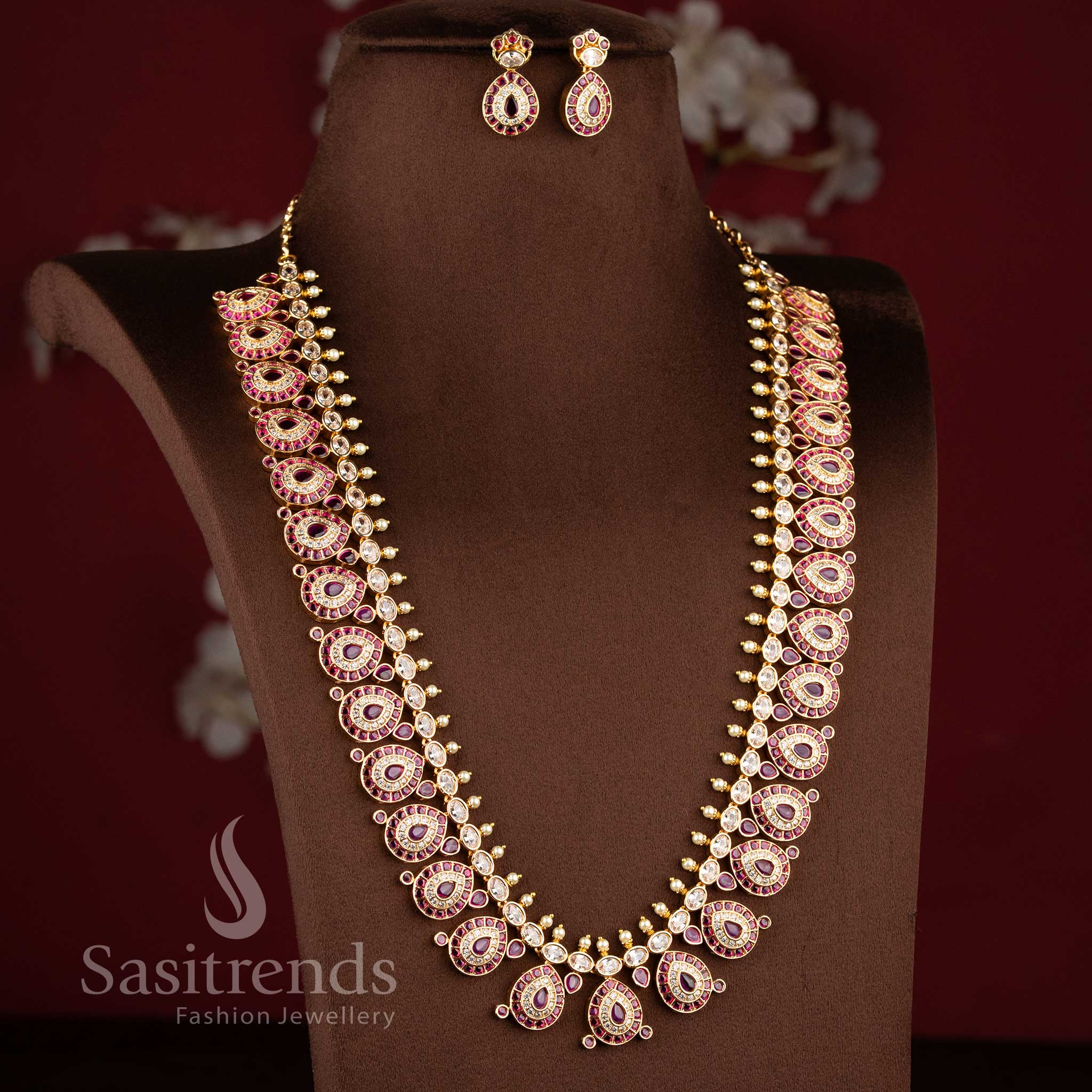 Grand micro gold plated tear drop motif White ruby long necklace combo set with matching earrings by Sasitrends.
