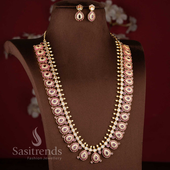 Grand micro gold plated tear drop motif White ruby long necklace combo set with matching earrings by Sasitrends.