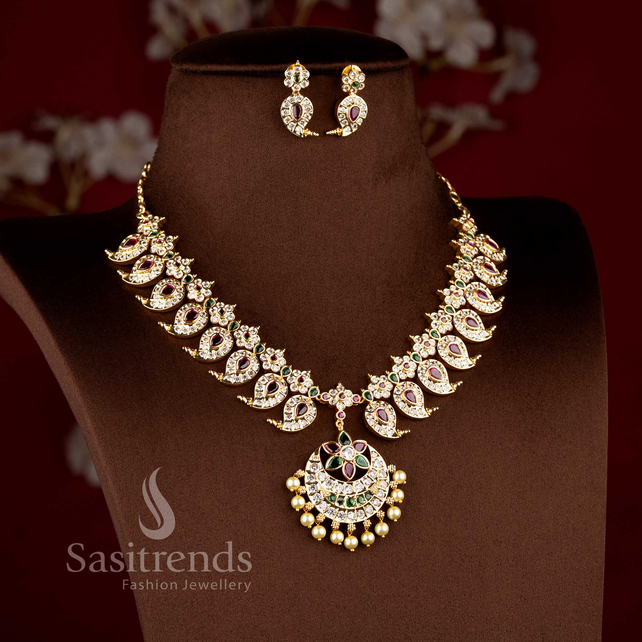 Traditional micro gold plated manga malai short necklace with a multi stone-studded crescent chandbali pendant by Sasitrends.
