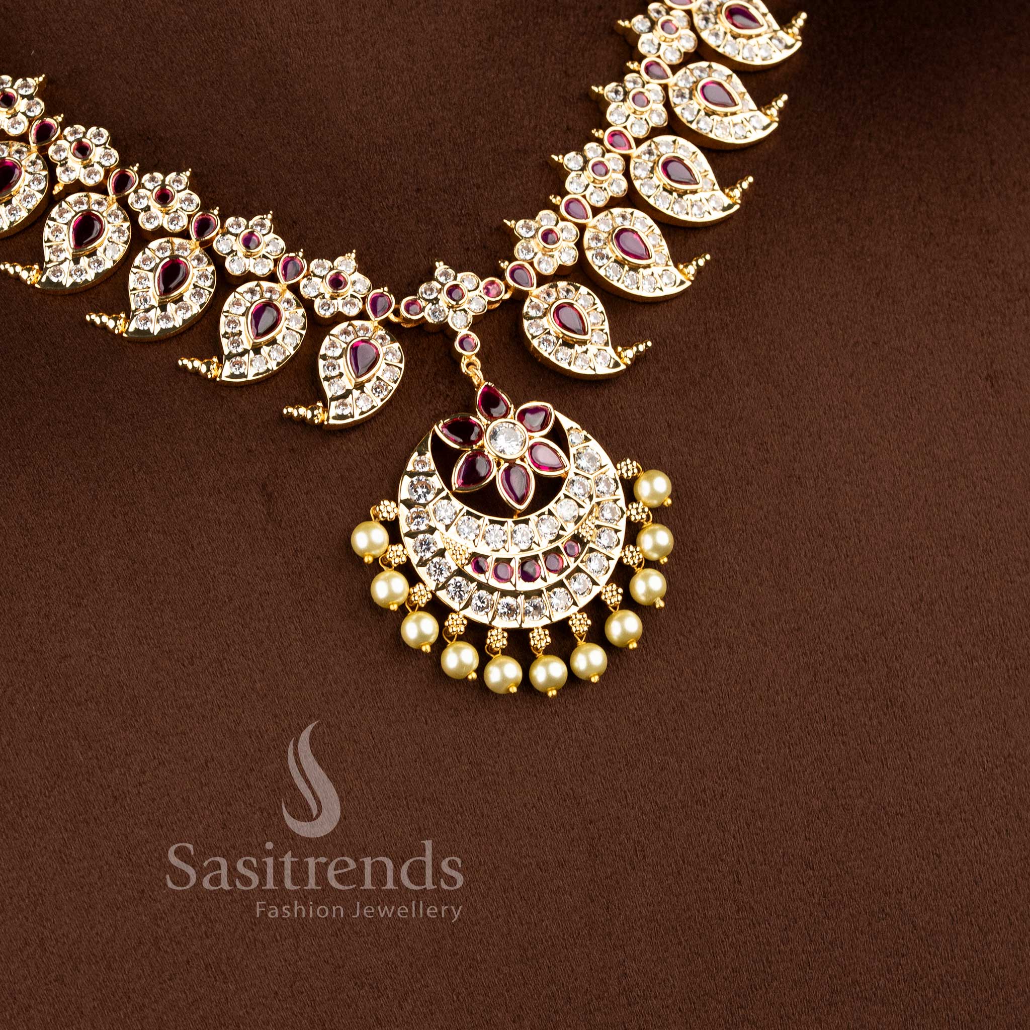 Real gold look wedding wear short necklace showcasing a pearl drop floral blossom centerpiece.
