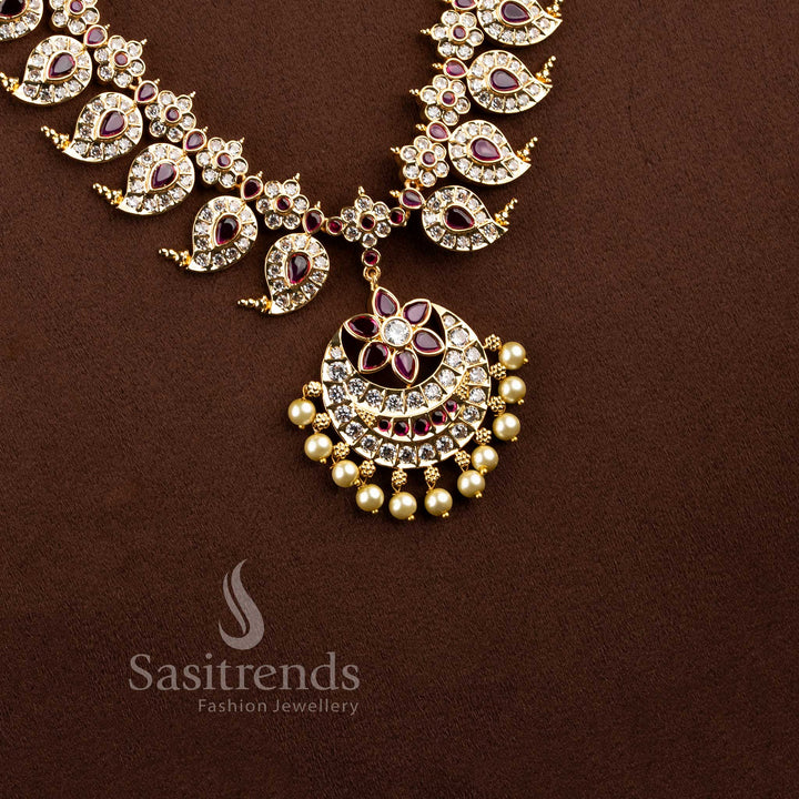 Real gold look wedding wear long necklace showcasing a pearl drop floral blossom centerpiece.