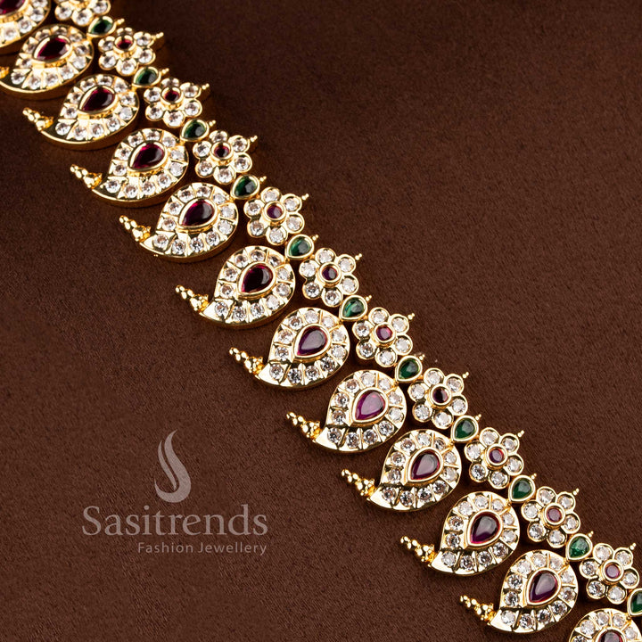 Festive wear south indian style paisley neckpiece beautifully arranged on a brown surface.