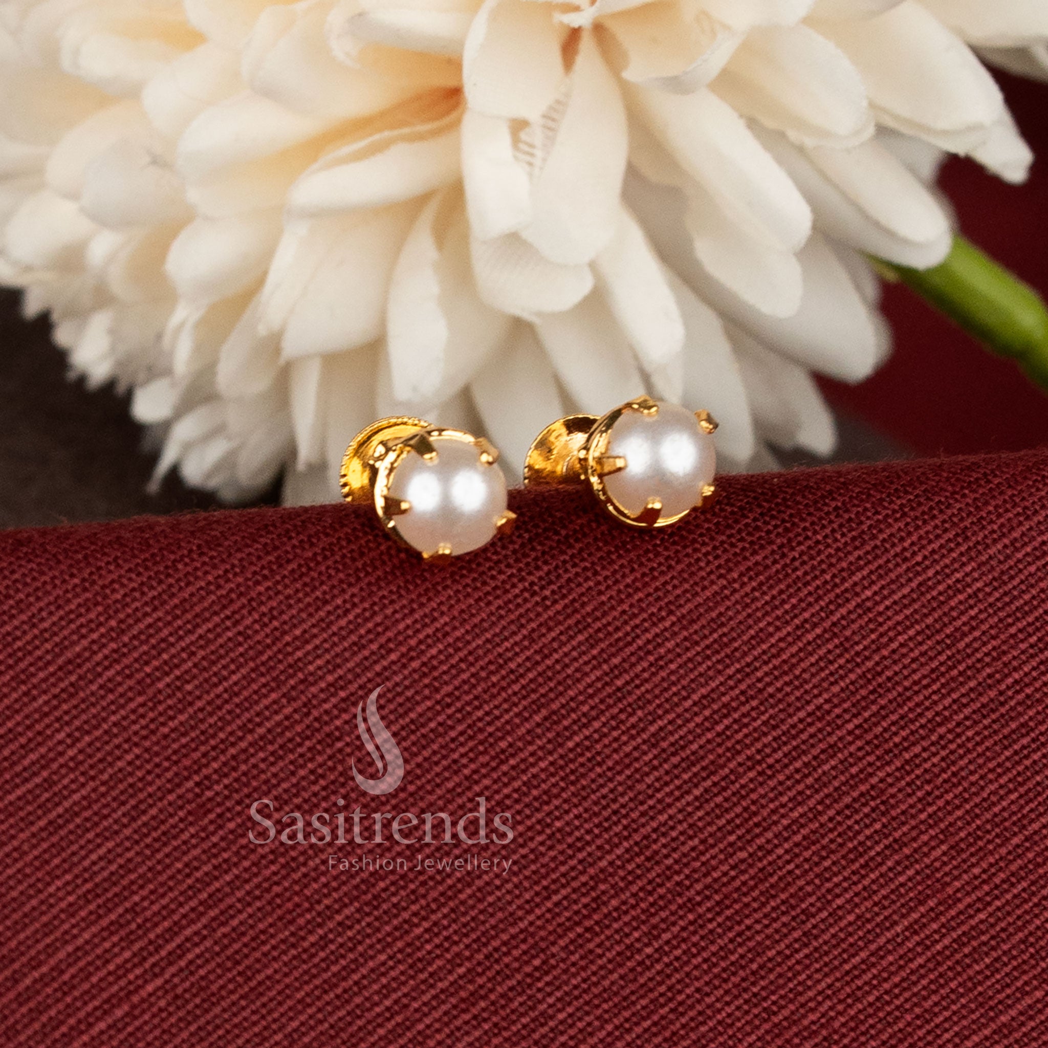 Real gold look screw type stud earrings crafted with detailing and elegant stone setting - Sasitrends.