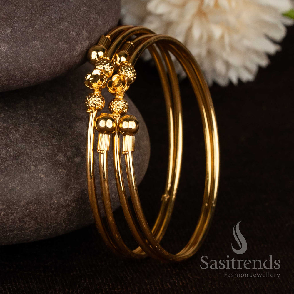 Gorgeous double heart textured ball micro gold plated bypass bangles for festive wear - Sasitrends