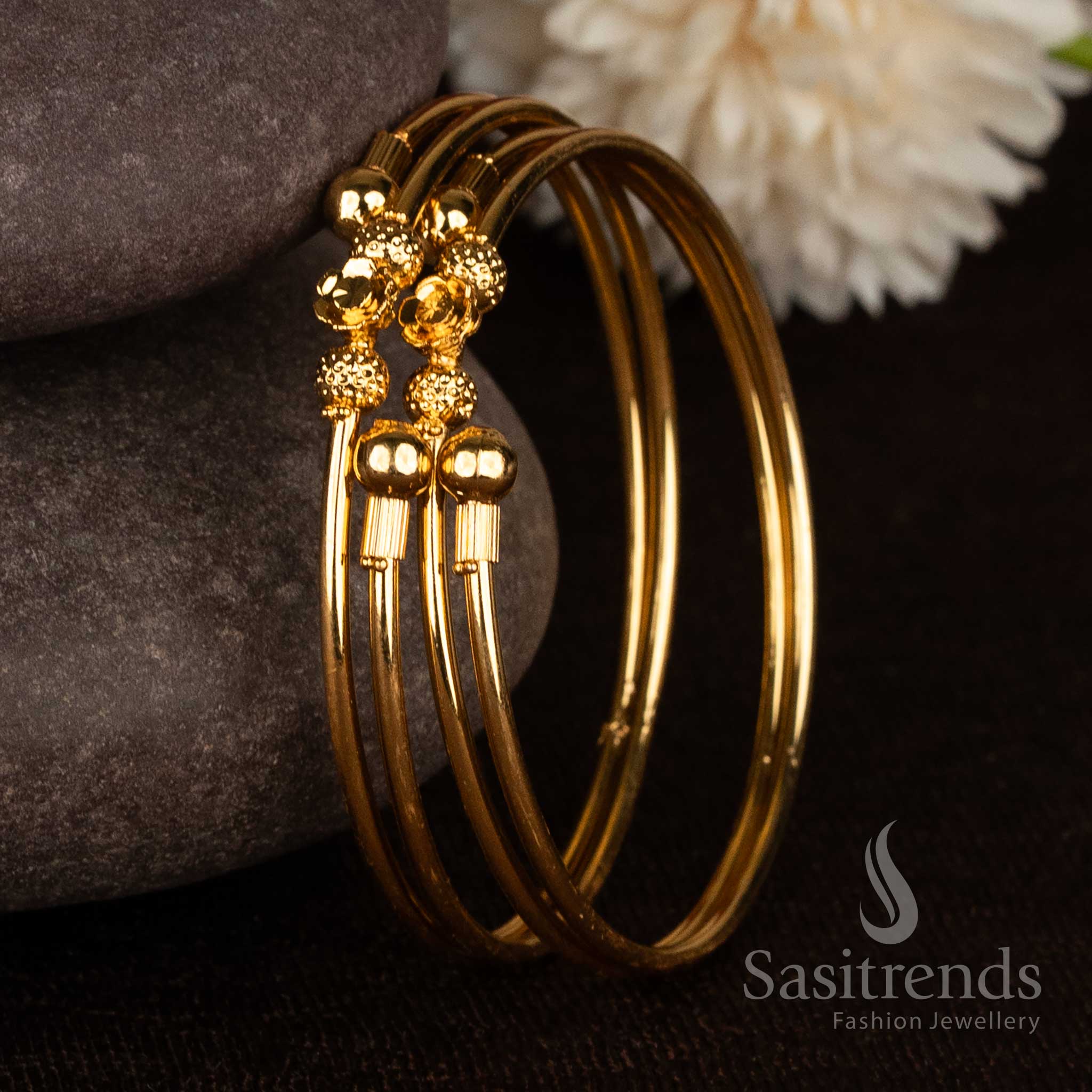 Gorgeous double heart textured ball micro gold plated bypass bangles for festive wear - Sasitrends
