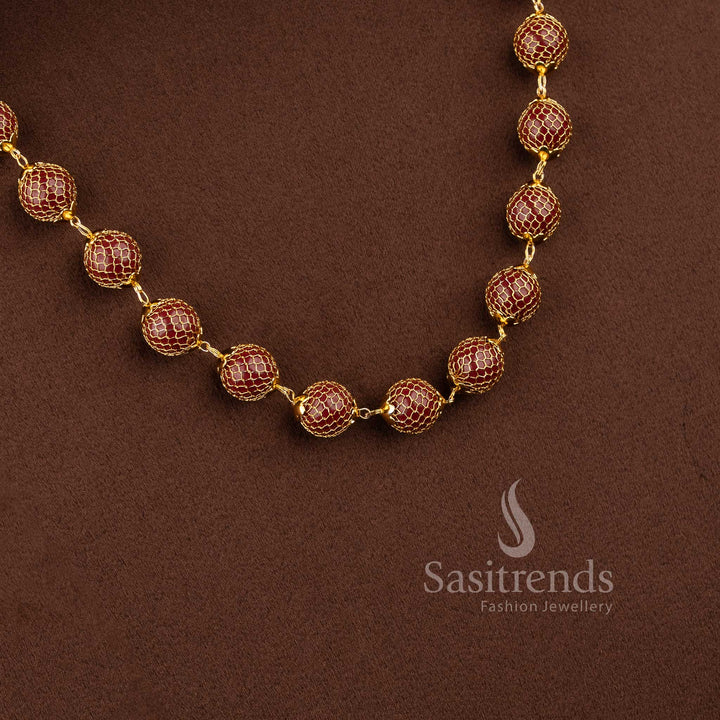 Festive wear pearl chain necklace with intricate mesh design and red stone embellishment - Sasitrends