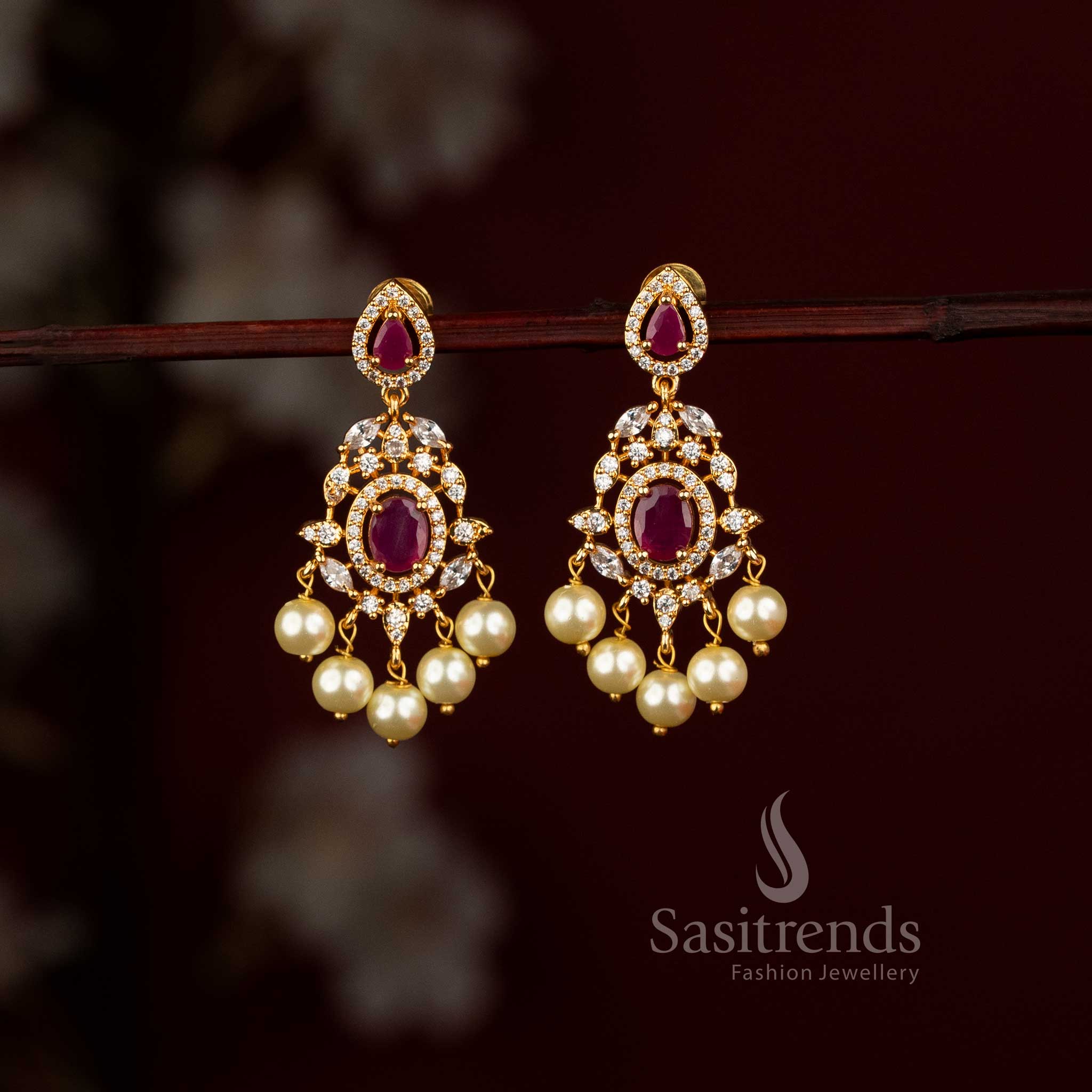  micro gold plated American Diamond chandelier earrings featuring a centre stone and elegant pearl drops