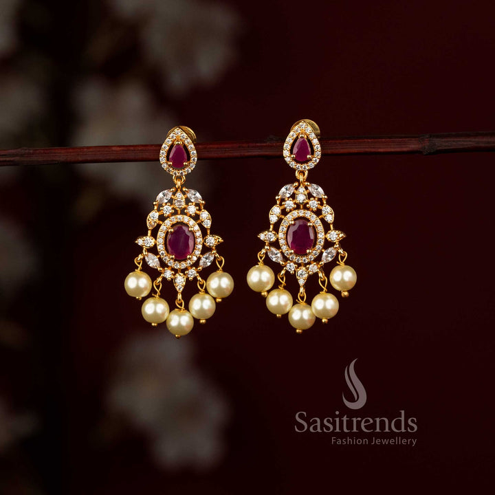  micro gold plated American Diamond chandelier earrings featuring a centre stone and elegant pearl drops