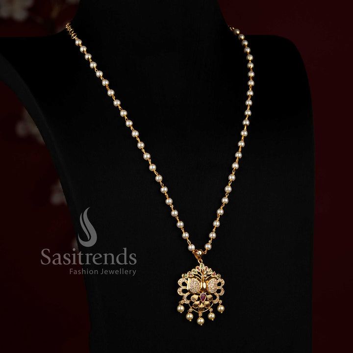 Long traditional women’s necklace featuring a fine continuous beaded chain, compact circular floral pendant structure, detailed central motif, sparkling AD stone accents and decorative drops