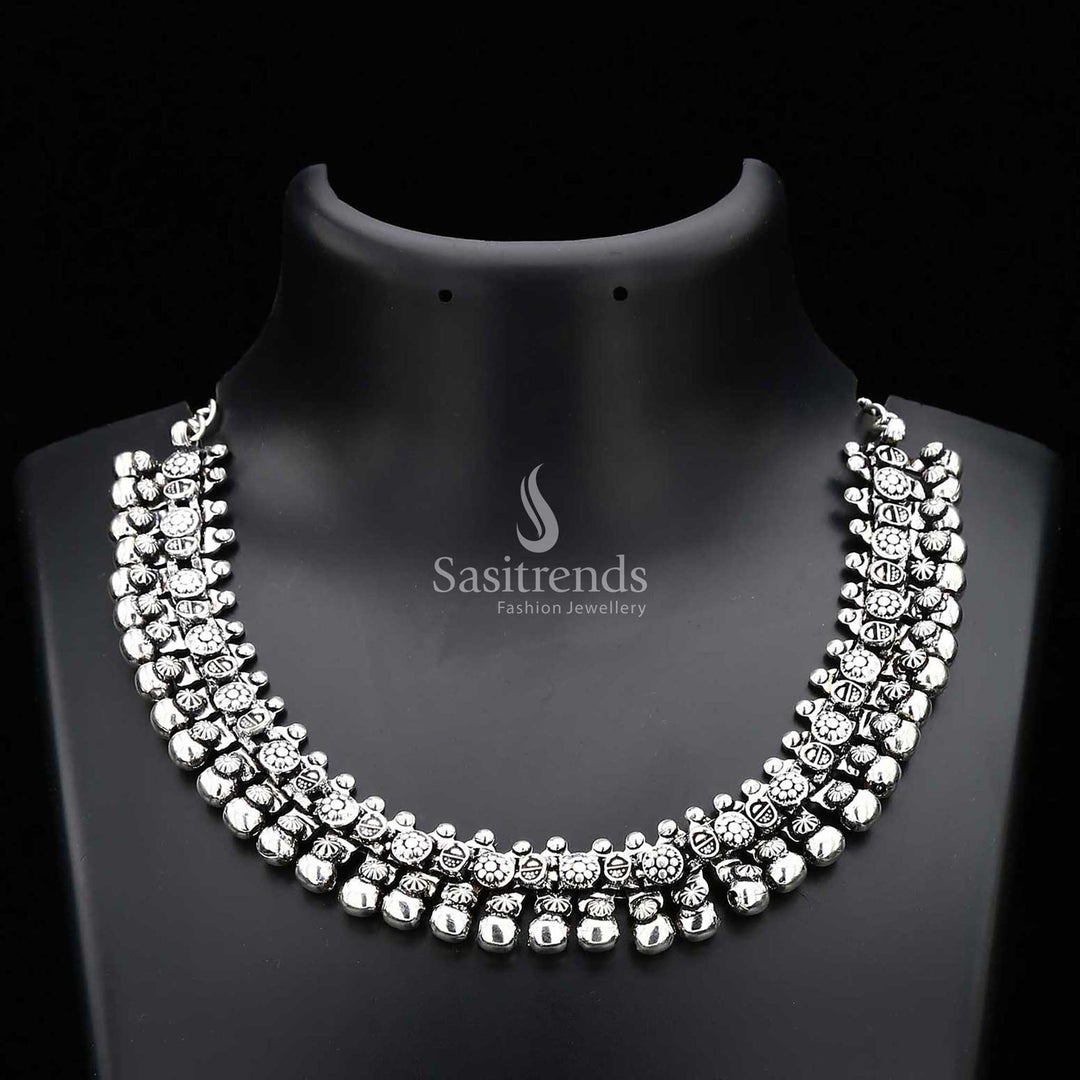 Haara oxidised silver tribal design necklace from the Elegance Collection, featuring etched floral motifs and pearl drops for a bold statement jewellery piece rooted in heritage – Sasitrends
