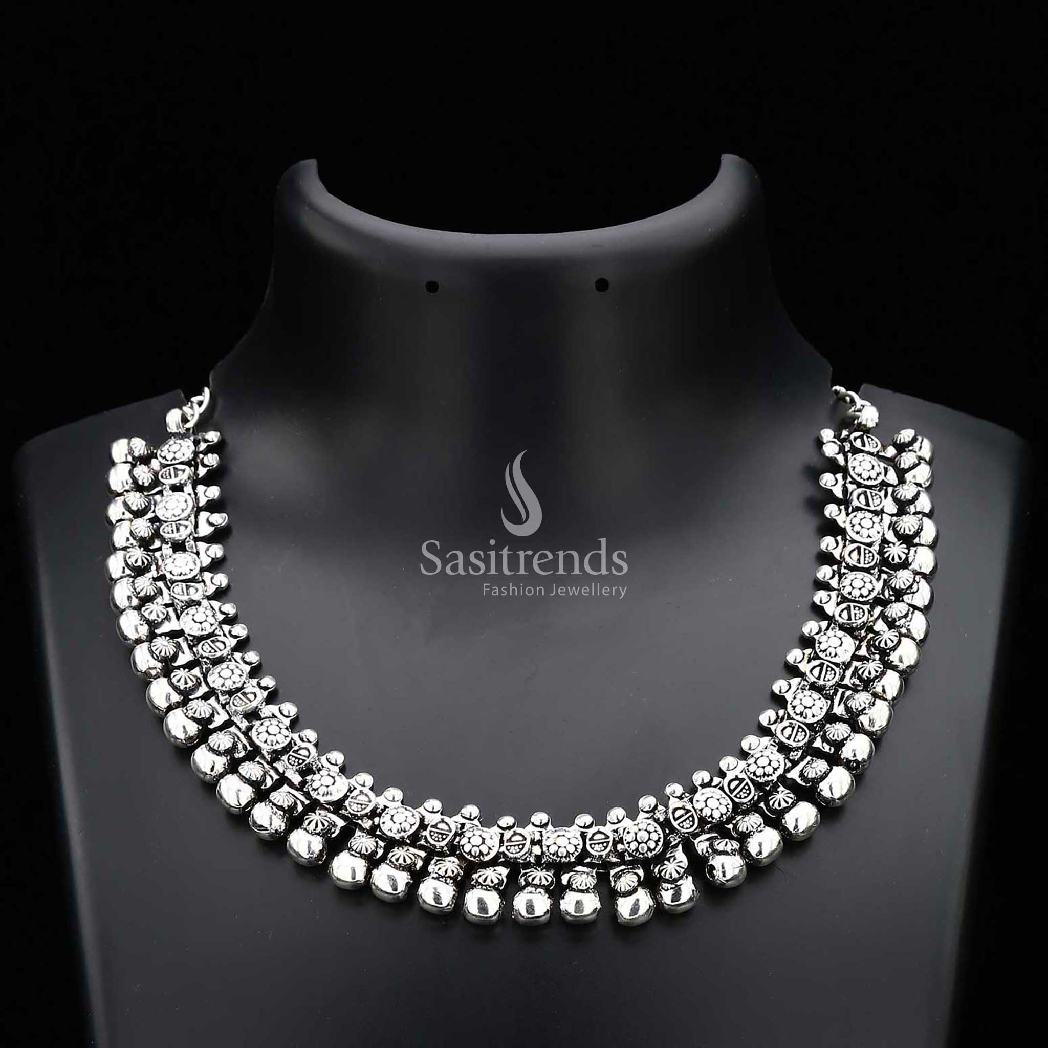 Haara oxidised silver tribal design necklace from the Elegance Collection, featuring etched floral motifs and pearl drops for a bold statement jewellery piece rooted in heritage – Sasitrends