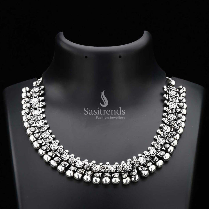 Haara oxidised silver tribal design necklace from the Elegance Collection, featuring etched floral motifs and pearl drops for a bold statement jewellery piece rooted in heritage – Sasitrends