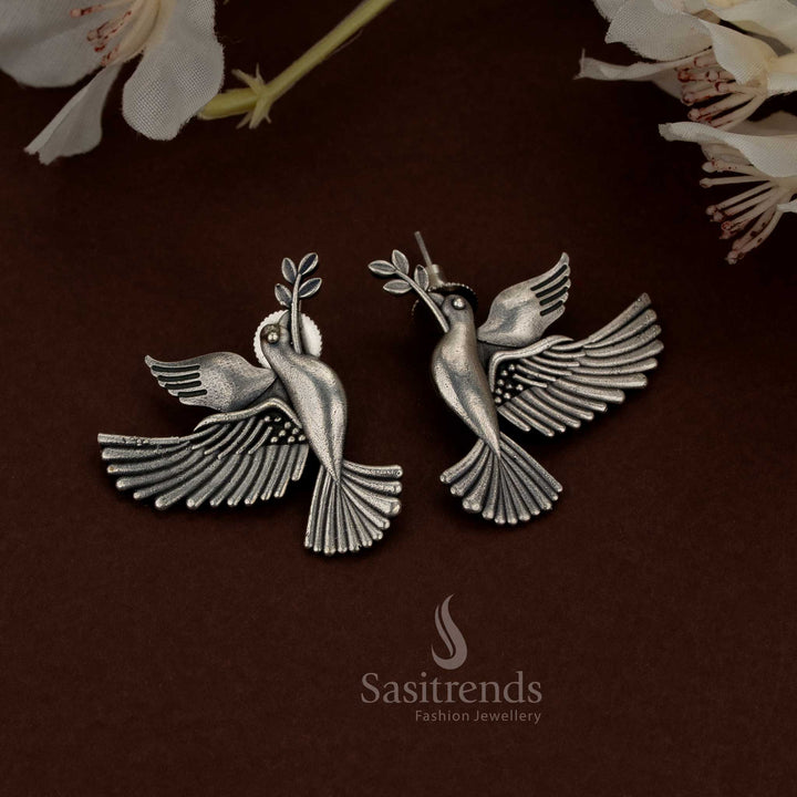 Artistic oxidised silver earrings with nature-inspired motif for casual and ethnic wear - Sasitrends