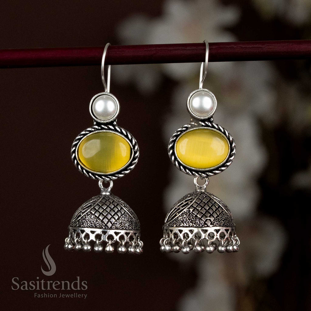 Elegant Oxidised Silver Jhumka Earrings Featuring Light Yellow Oval Stone And Delicate Pearl Hangings, Designed To Add A Soft Glow To Ethnic And Casual Looks – Sasitrends
